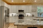 Fully-Stocked Kitchen with Granite Countertops
